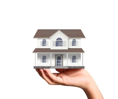 Hand holding a house
