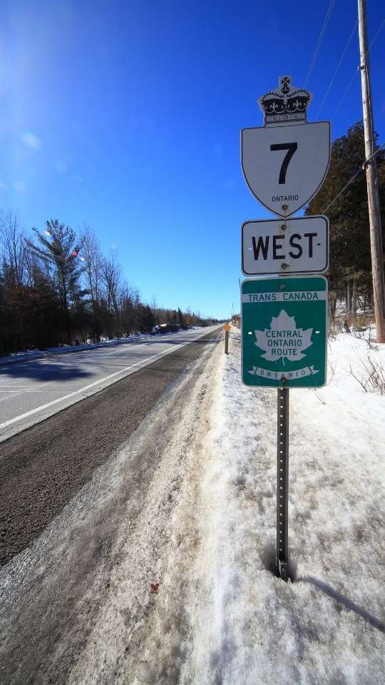 7 West sign on snowy highway