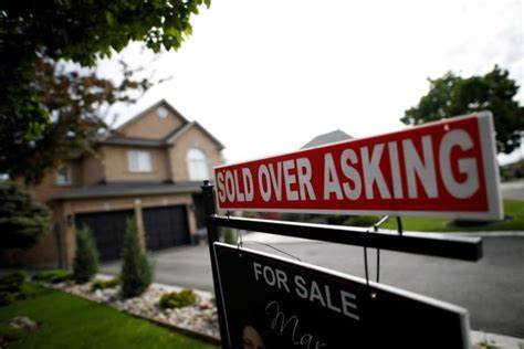 Sold over asking sign