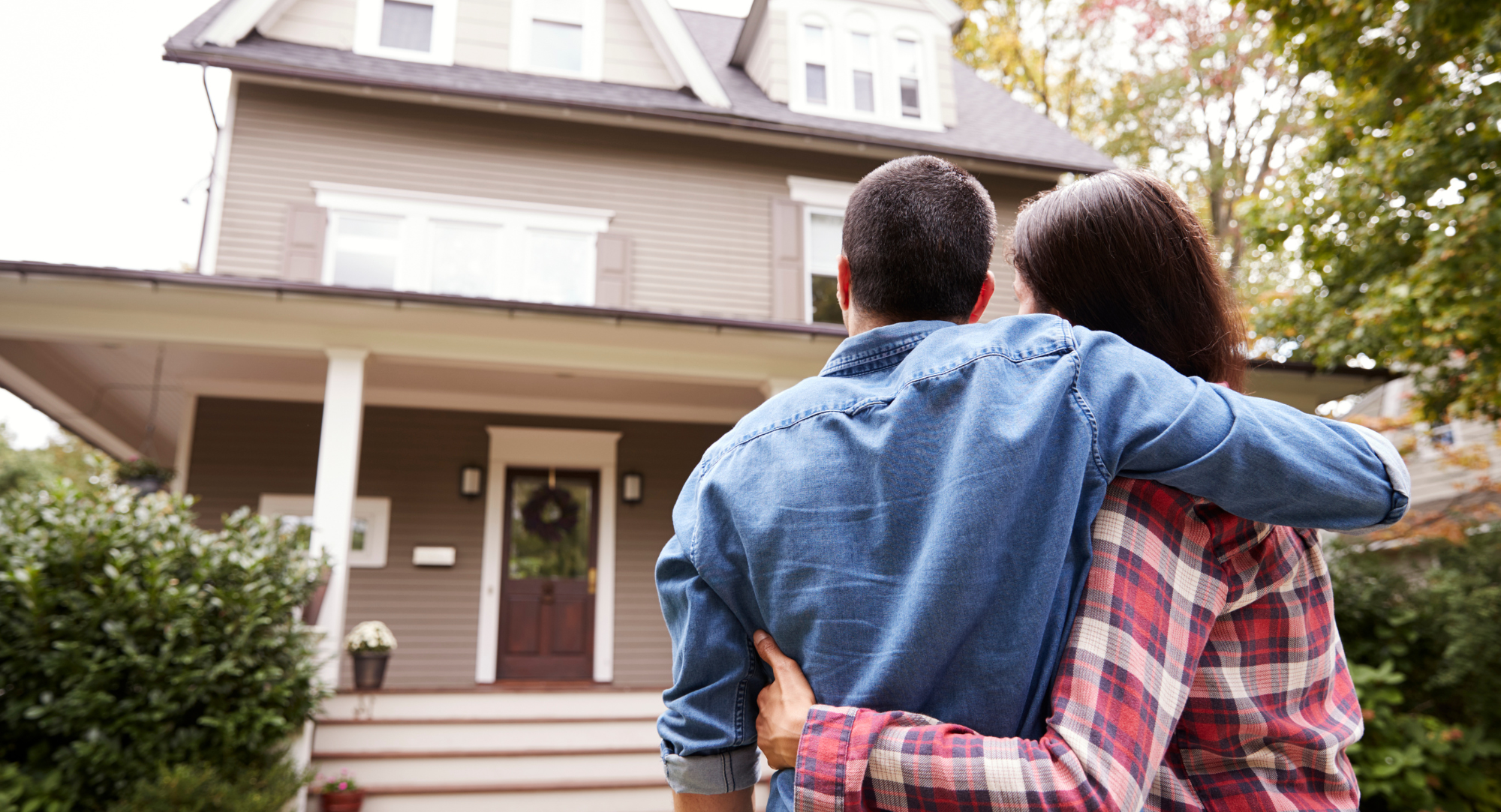 couple looking at their home